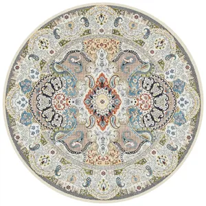 Vue détaillée du tapis rond vintage bohème avec un motif floral perse et cachemire.