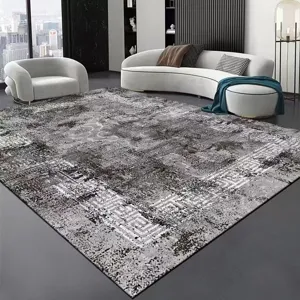Modern minimalist gray area rug scene detail, stylish living room carpet with chic geometric border.