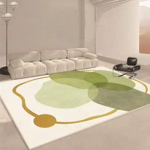 Modern minimalist large faux cashmere living room rug with abstract green geometric circles pattern.