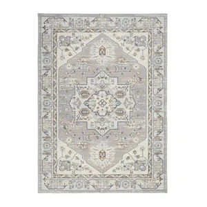 Detailed view of the vintage bohemian style Persian carpet with intricate patterns.
