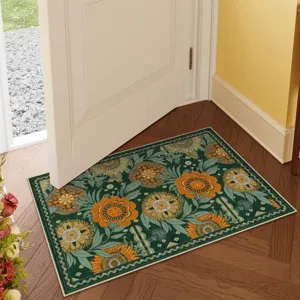 Detailed view of vintage floral doormat with vibrant orange flowers on rich green background.