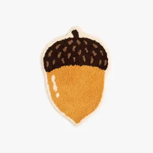 Cute acorn shaped fluffy floor rug detail shot, soft plush texture and non-slip backing.