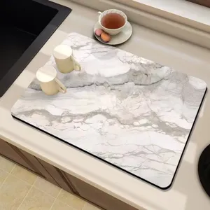 Kitchen drying mat with marble texture, absorbent tech cloth, non-slip counter pad.