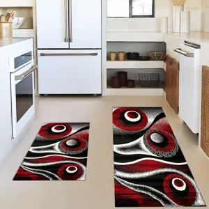 Kitchen rug set detail view, abstract red and black design, non-slip floor mat for cooking area.