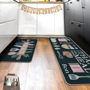 Vintage kitchen mat detail showing cute cooking utensils pattern and textured anti-slip surface.