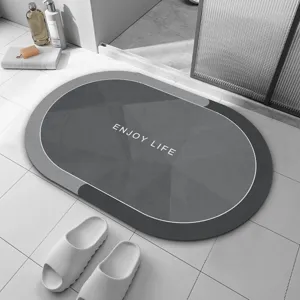 Tapis de bain ovale en terre de diatomée, modèle gris absorbant et antidérapant sol.
