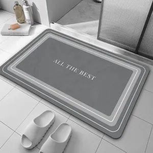 Tapis de bain minimaliste en terre de diatomée, détail absorbant et antidérapant.