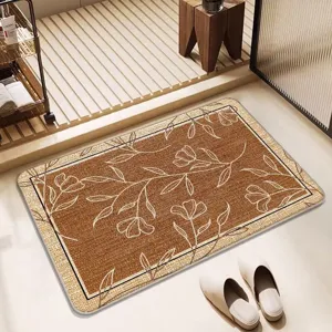 Detailed close-up view of the absorbent bath mat with elegant floral pattern in bathroom setting.