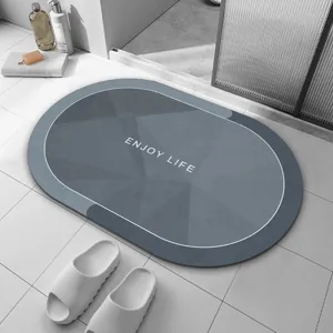 Tapis de bain oval minimaliste en terre de diatomee absorbant antiderapant de cuisine.