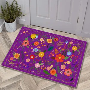 Close up detail view of vibrant floral non-slip cashmere-feel doormat in room decor.