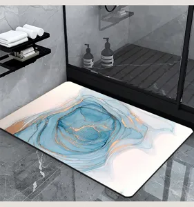 Absorbent diatomaceous earth bath mat with modern blue gold abstract fluid art design.