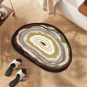 Detailed close-up view of irregular absorbent diatomaceous earth floor mat with abstract pattern.