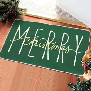 Détail de paillasson de Noël, tapis d'entrée vert festif avec message de vœux chaleureux.