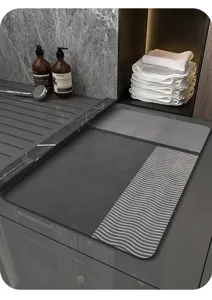 Gray diatomaceous earth bath mat with wave texture, anti-slip absorbent floor mat for bathroom.