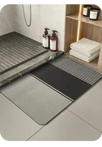 Minimalist diatom mud bath mat with stylish grey and black striped design for modern bathroom use.