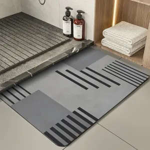Minimalist grey diatomaceous earth bath mat, absorbent non-slip floor mat for bathroom.