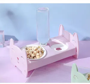 Pink cat ear double pet bowl with automatic water bottle dispenser for cats and dogs feeding.