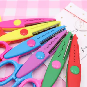 Close-up detail of colorful craft lace scissors for DIY clay and handmade art projects.