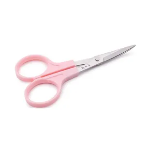 Close-up detail shot of pink craft scissors with stainless steel blade and plastic handle.