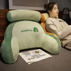 Comfortable cartoon latex bed reading pillow with armrests and headrest for cozy relaxation.