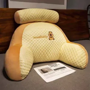 Detail view of the ergonomic bed rest reading pillow with headrest and armrests, cozy texture.