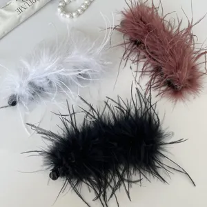 Detailed view of fluffy feather hair claw clips featuring soft texture and stylish color options.