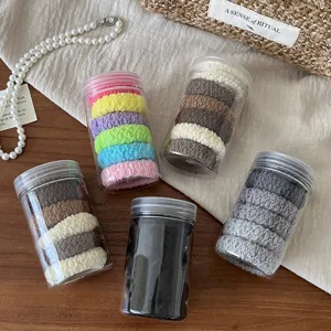 Elastic hair ties set in clear jars, colorful durable thick rubber bands for thick hair ponytails.