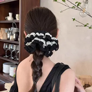 French style black scrunchie with white lace trim, elegant hair tie for women's low ponytail styling.