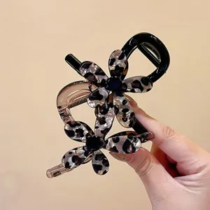 Molletta per capelli fiore maculato, elegante pinza artiglio in acrilico per acconciature chic.