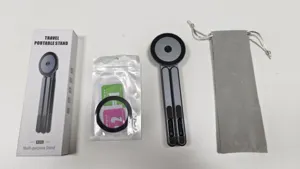 Portable magnetic aluminum alloy stand for laptops, tablets, and phones, travel friendly.