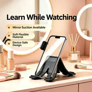 Flexible X-shaped suction phone stand, soft silicone material, ideal for desktop and car use.