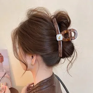 Large tortoiseshell hair claw clip with gold puppy accent for thick hair styling accessories