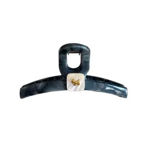 Large marbled hair claw clip with elegant golden dog charm, secure grip for thick hair styling.