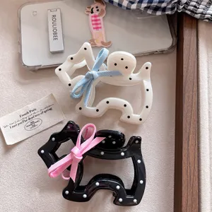Cute polka dot puppy hair claw with bow, sweet acrylic shark clip for daily hair styling.