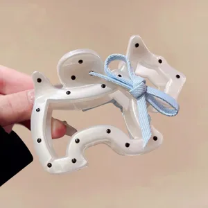 Cute puppy hair claw clip with blue bow and black polka dots for women and girls daily hair styling