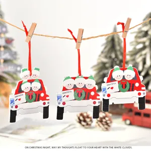Close-up detail of wooden family car Christmas tree hanging ornaments with cute holiday decor.