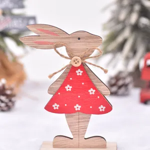 Easter wooden rabbit ornament with red floral dress and rustic twine bow for spring decor.