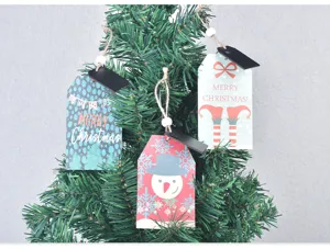 Wooden Christmas tree hanging tags with cute holiday patterns and festive blessing text.