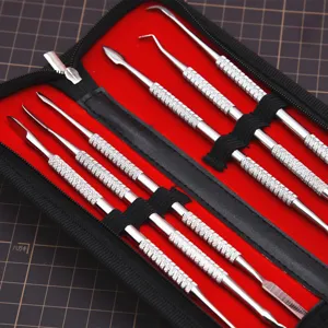 Stainless steel clay sculpting tool set detail, precision carving knife set with black case.