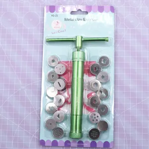 Detailed view of green metal clay extruder tool with multiple shaping discs for DIY craft.