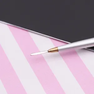 Stainless steel clay sculpting tool with flat spatula tip for soft pottery and doll modeling detail work.
