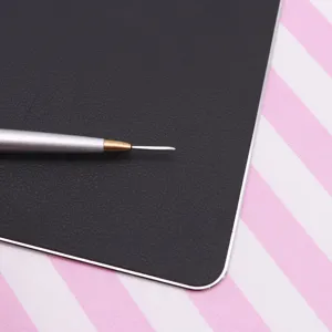Fine stainless steel clay sculpting tool detail close-up showing precision needle tip design.