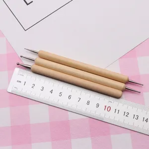 Detailed view of wooden handle metal ball stylus dotting tools, set of three for clay craft.