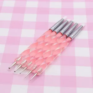 Detail view of double-ended silicone nail art shaping and clay sculpting pens with pink handle.