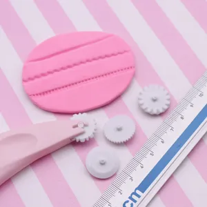 Polymer clay lace roller embossing tool set with interchangeable gear cutter wheels.