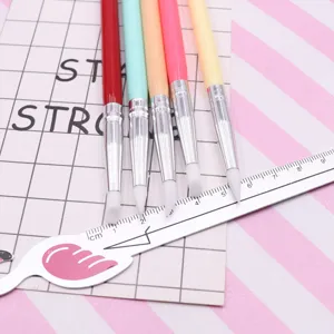 Silicone sculpting pen detail showing soft white tips and colorful handles for DIY clay crafting.