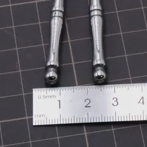 Stainless steel ball head clay sculpting tool detail view showing precise dimensions with ruler.