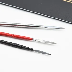 Stainless steel clay sculpting eye opening knife tool for doll making and pottery crafting detail.