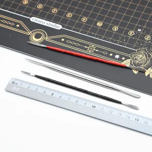 Stainless steel clay sculpting tool set, detail view of double-ended carving knife for doll making.
