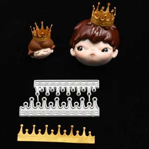 Close-up detail shot of resin clay cartoon doll head and crown cutting die for DIY craft projects.